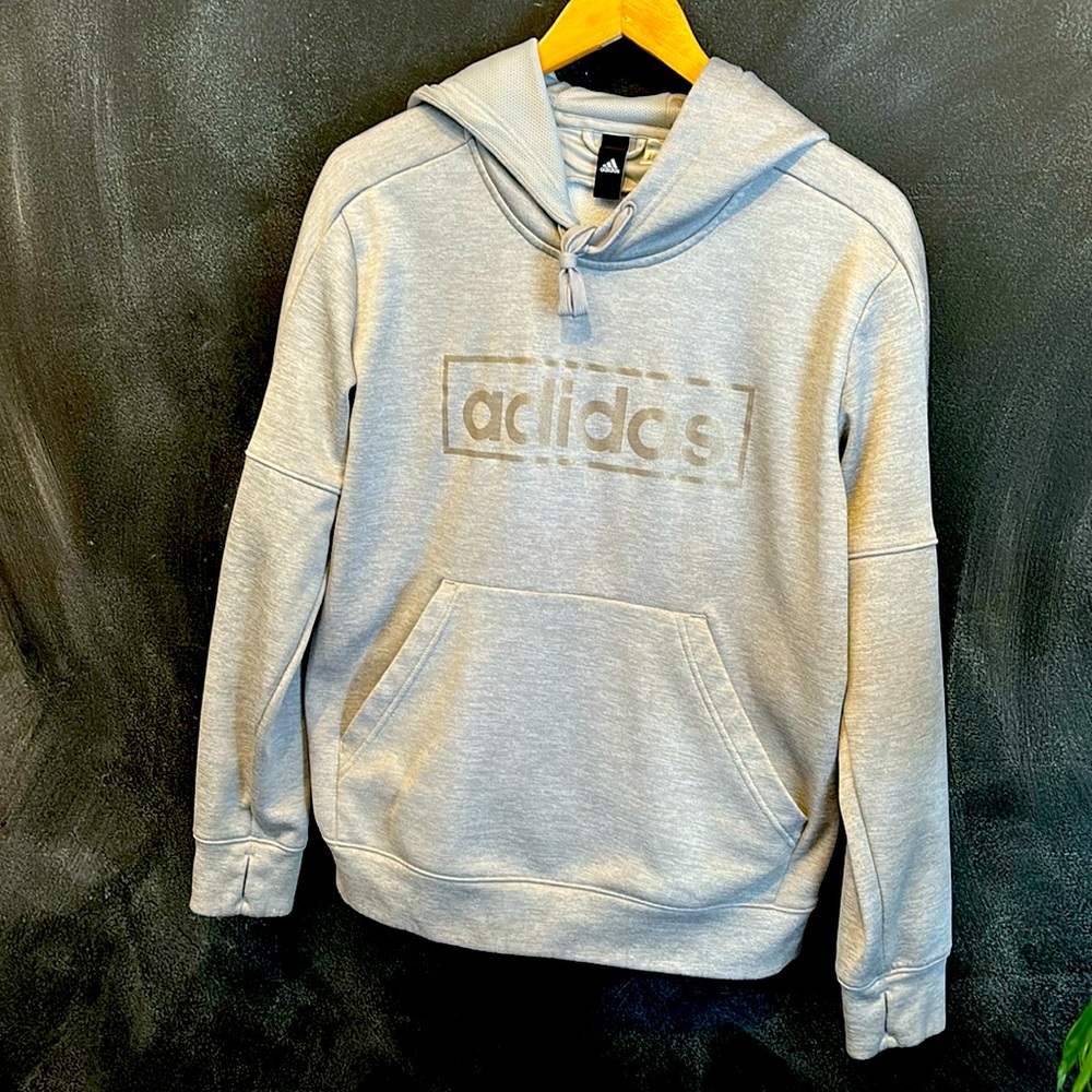 Adidas grey small hoodie. Never worn. No tags silver gold printing sporty